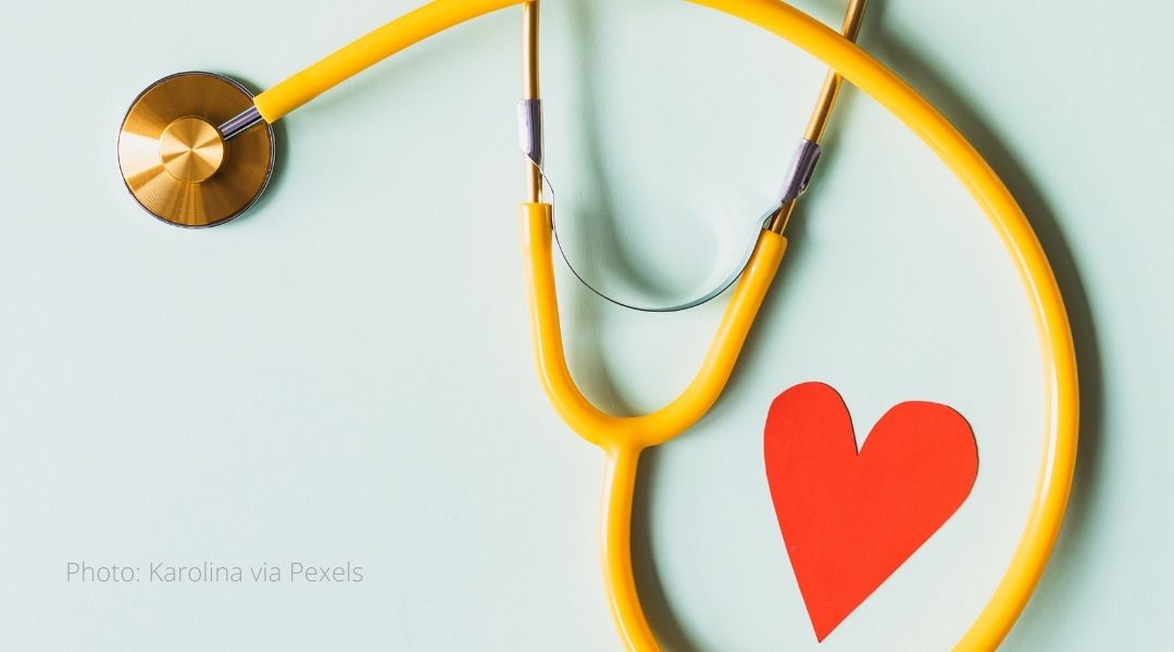 A stethoscope and a paper heart