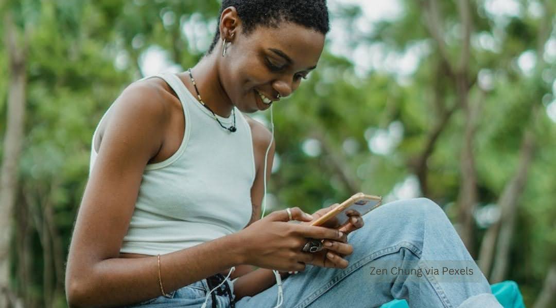 A young woman is engrossed in smart phone activities